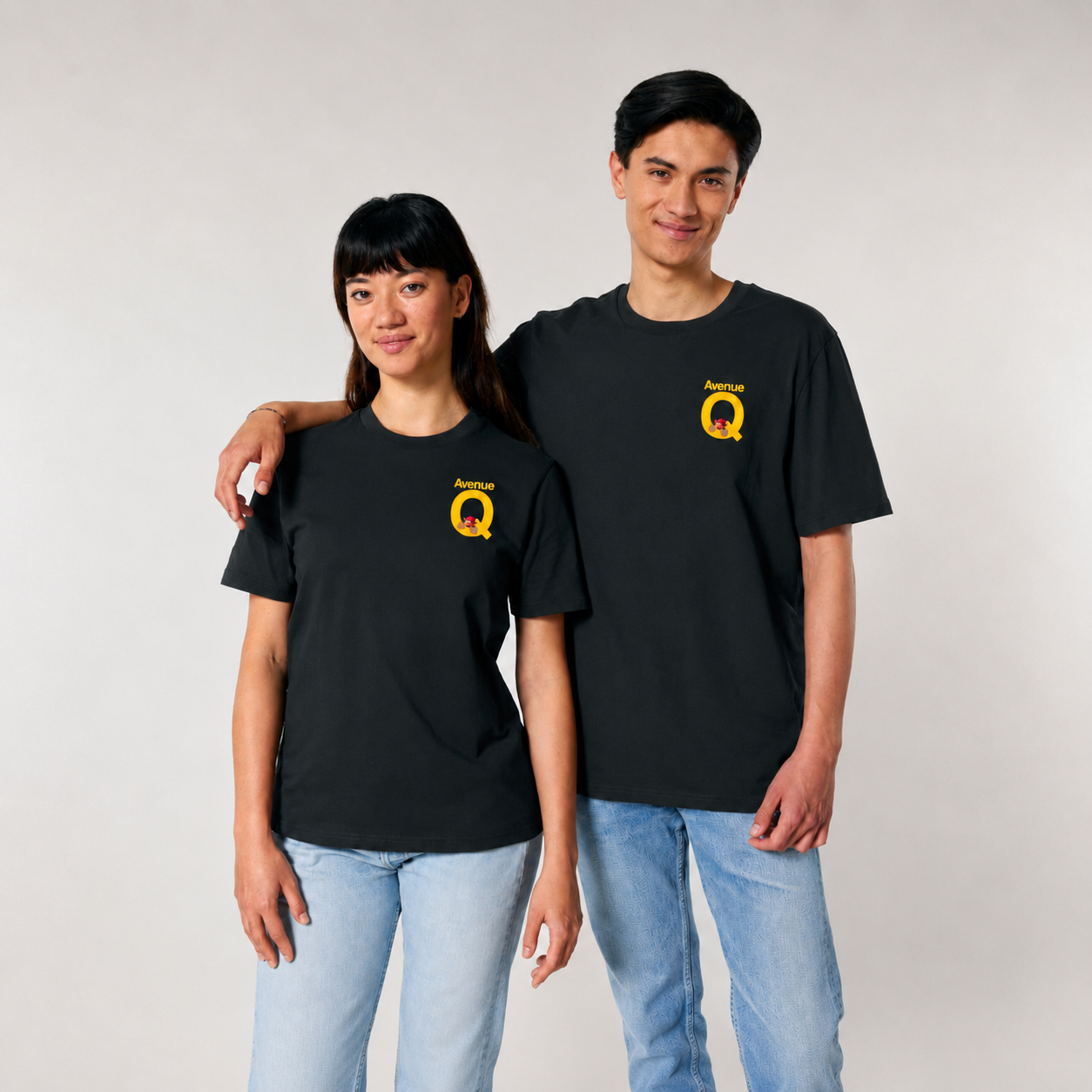 Models wearing the official Avenue Q black T-shirt from the 2026 West End production