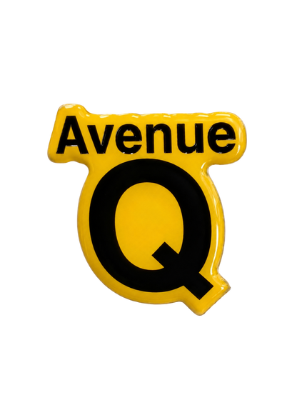 Official Avenue Q glossy pin badge from the 2026 West End run at the Shaftesbury Theatre